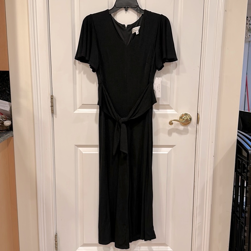 Jumpsuit wide leg. Black size 6.  Signature by Robbie Bee New.